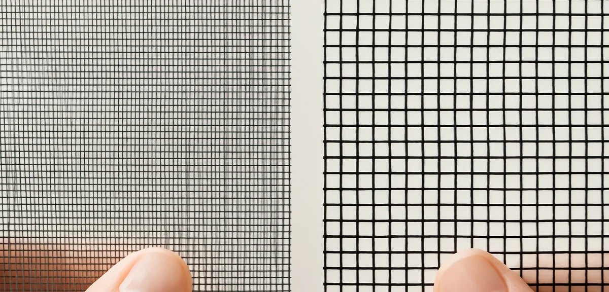Close up comparison of two screen mesh samples with different weave densities held against the light